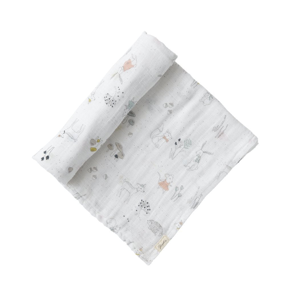 Pehr Magical Forest Organic Novelty Swaddles. Organic cotton, hand printed. White with forest animal and plant pattern.